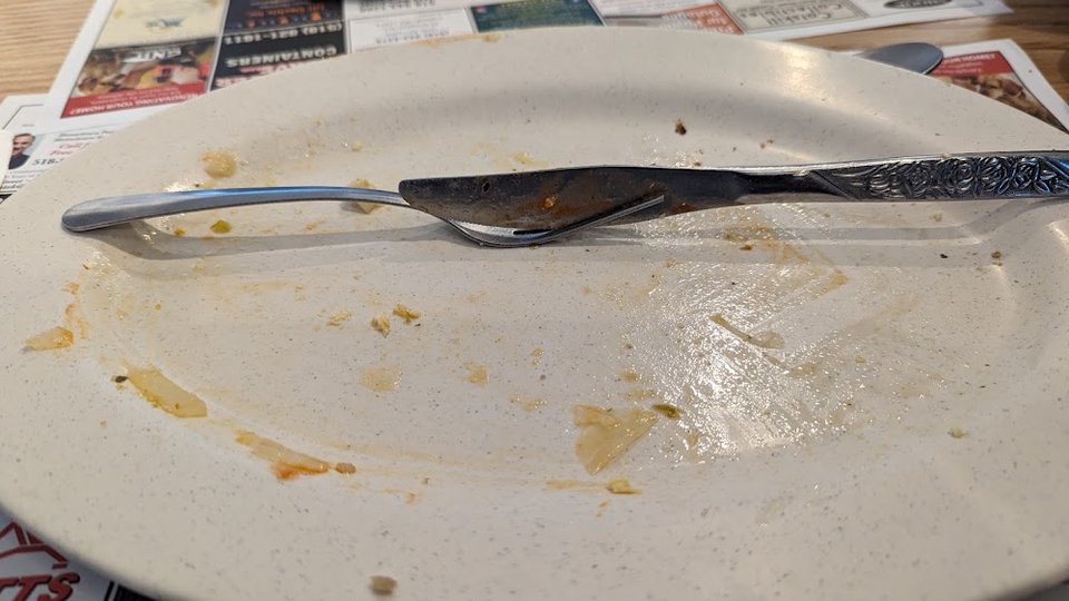 An Empty Plate After Eating Italian Omelette