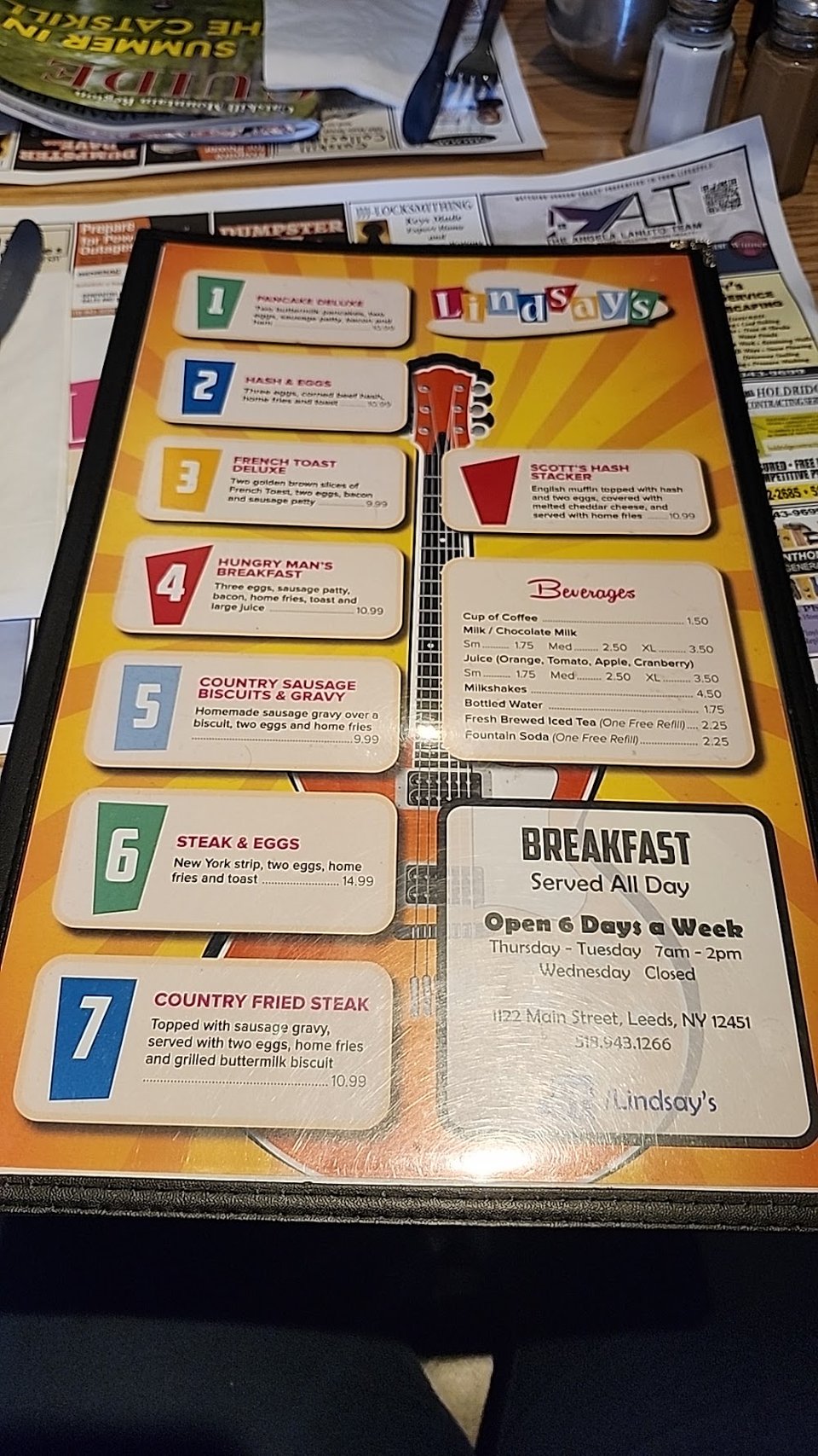 Breakfast menu with eggs and pancakes.